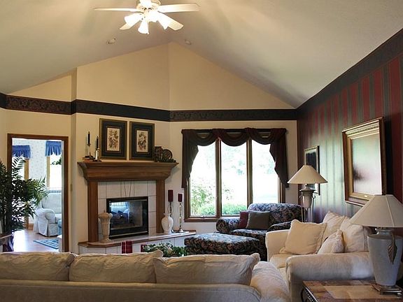 Great room with cathedral ceiling and 2 sided fireplace