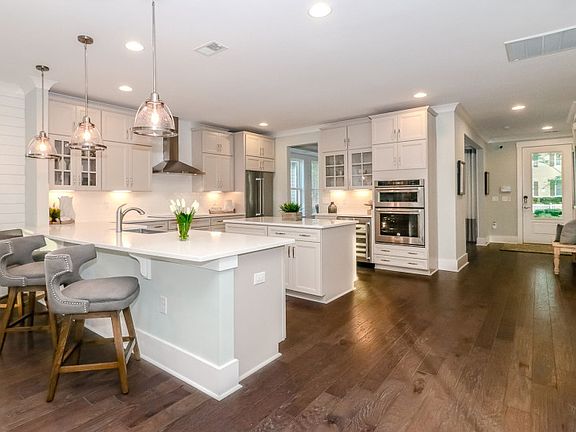 Spacious kitchen with quartz countertops and center island