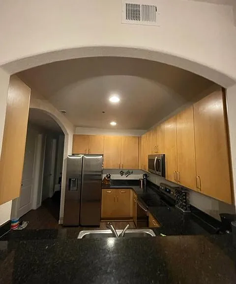 Looking into kitchen over breakfast bar