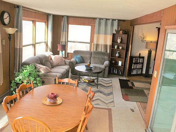 Sun Room is surrounded by windows in every direction. Great views of the back yard and wet lands. Wild life just outside your window no matter what season! Sun Room does have additional electric base board heat.