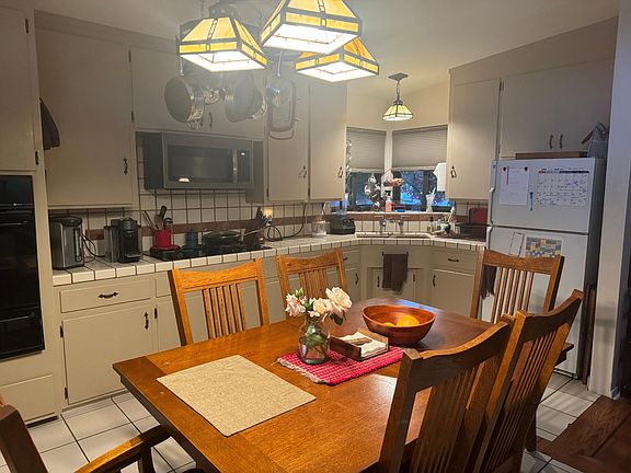 Mission style lighting, built in appliances (microwave above stove, plus conventional oven) lots of outlets.
