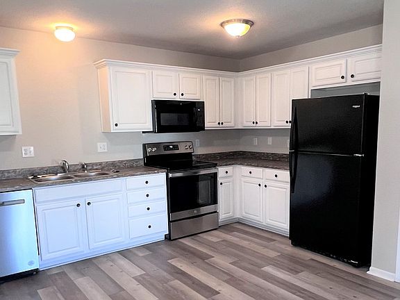 KITCHEN....ALL NEW APPLIANCES WITH TONS OF STORAGE. PANTRY IS DOOR TO THE RIGHT