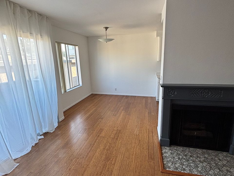 Dining Area, entrance to balcony and fireplace.