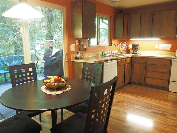 Kitchen has new appliances with deck for BBQ and outdoor dining.