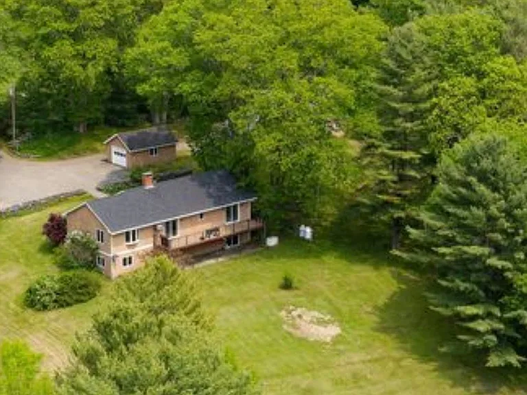 View of back yard and rear of home