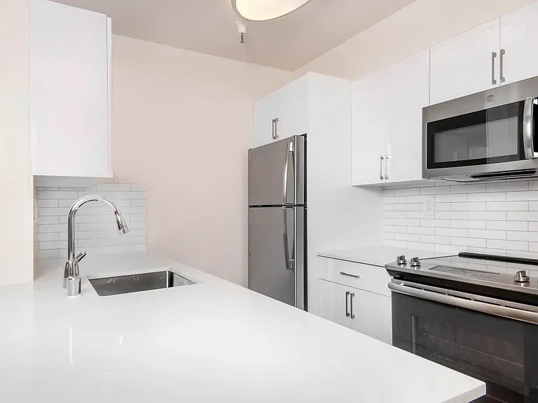 Renovated Kitchen with Stainless Steel Appliances and Granite Countertops