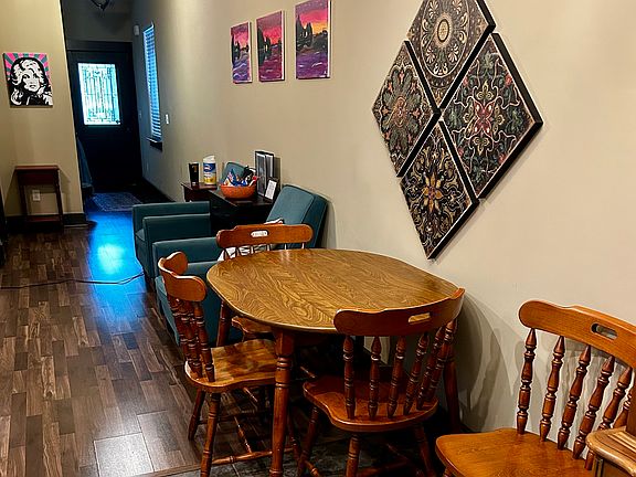 Couch and recliners seat 5 comfortably. Dining table seats 4.