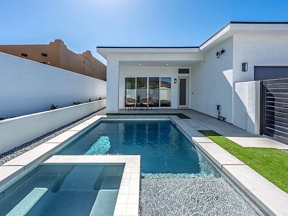 Eye-catching front-yard pool offers a rare blend of style, relaxation, and standout curb appeal.