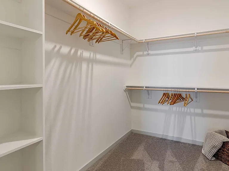 Keep everything organized in the oversized walk-in closet, complete with built-in shelving and ample hanging space for two.