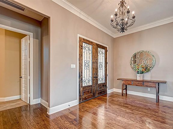 Elegant double doors open into an inviting foyer.