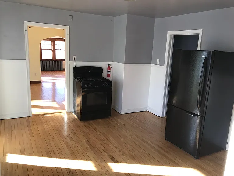 back door into kitchen looking toward the dining room and fr