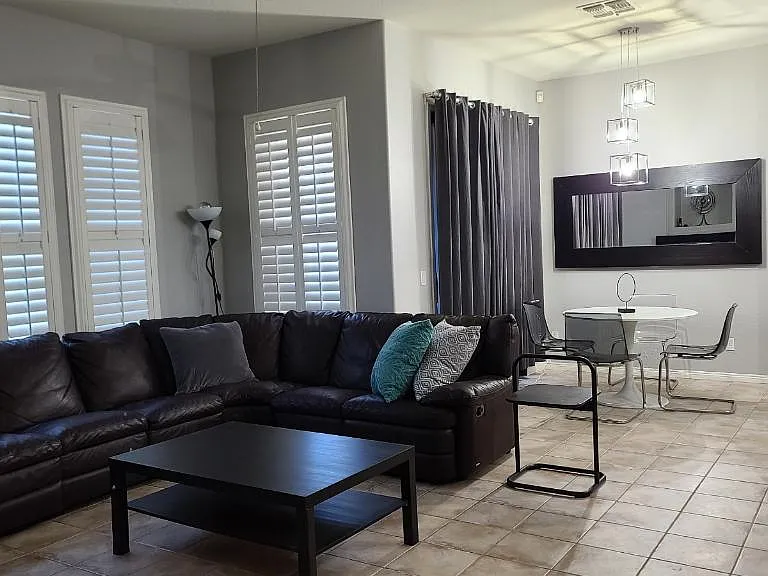 Family room, living room and sliding door to one balcony.
