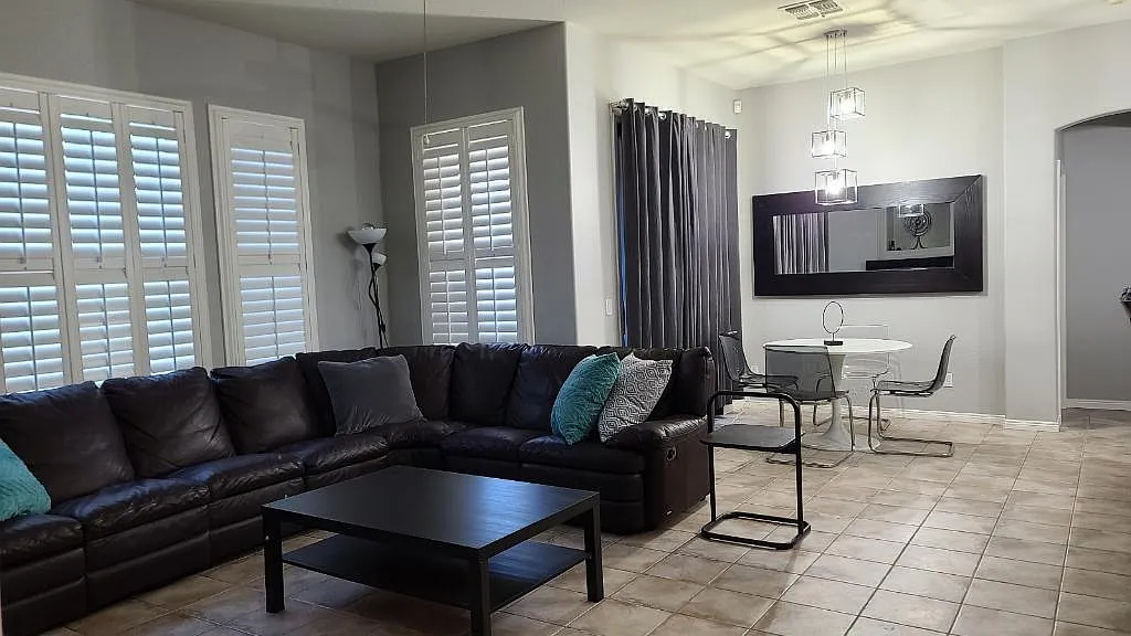 Family room, living room and sliding door to one balcony. - 3131 E Legacy Dr #2071