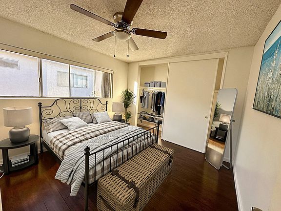 Spacious bedroom with ceiling fan