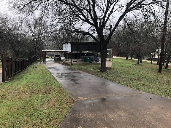Drive way with covered area and covered boat storage