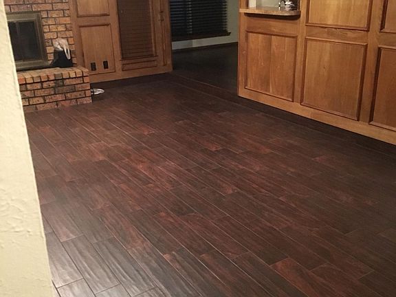 Sunken living room. Tile (looks like wood) floor. Wet bar, too!