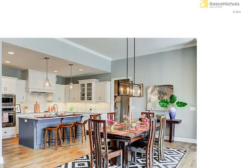 Spacious kitchen boasts generous amount of cabinets, counter space and a wonderful island.