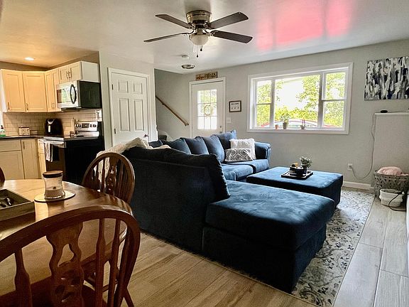 Open-concept living room with tile flooring (easy to clean)