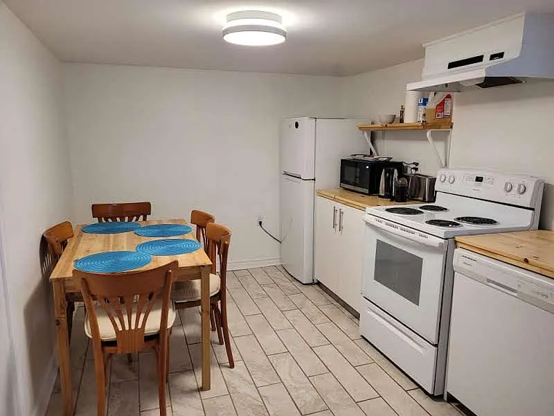 Full kitchen with dishwasher, toaster, and microwave
