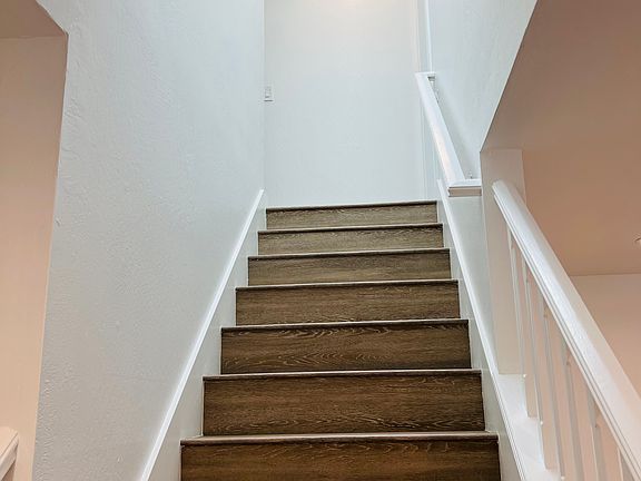 Stairs to 2 bedrooms and 2 en-suite bathrooms