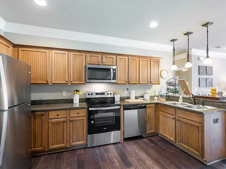 Enjoy a modern kitchen with stainless steel appliances at The Cottages of Hattiesburg.
