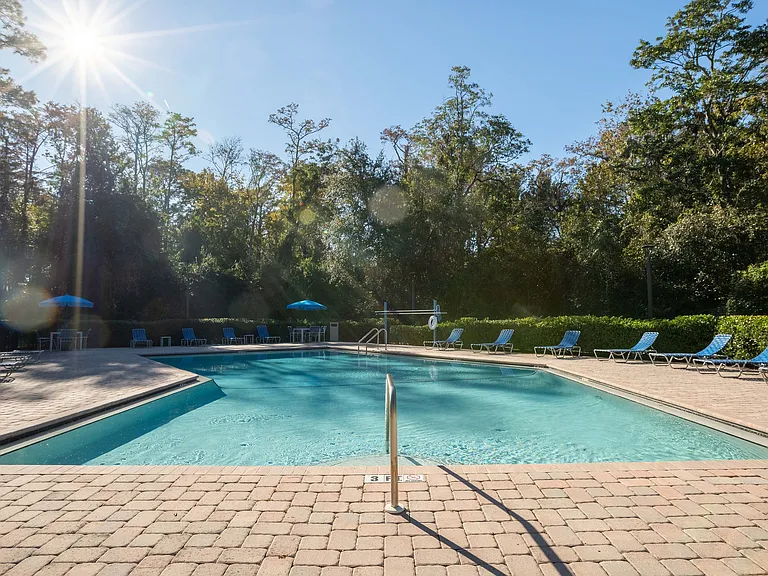 Experience relaxation and leisure by this stunning outdoor pool, perfect for sunny days.