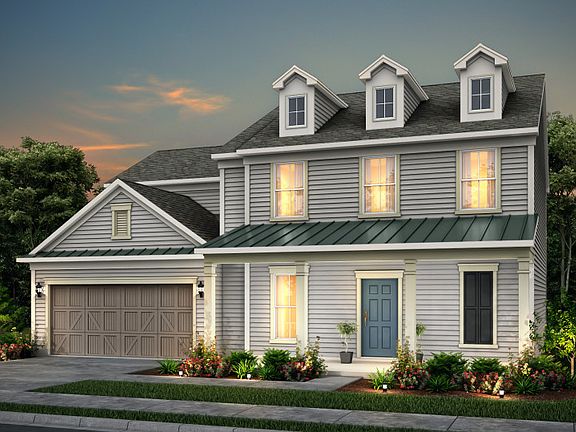 Rhodes exterior 52 features siding, covered front porch, and 2 car garage