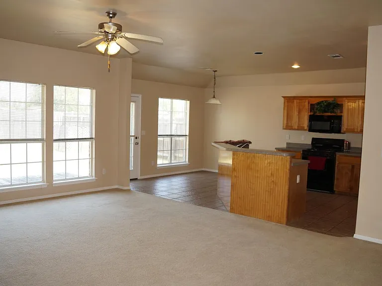 Large kitchen open to dining area and outdoors