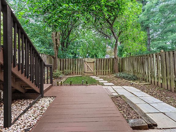 Lower deck is fenced and backs to trees!