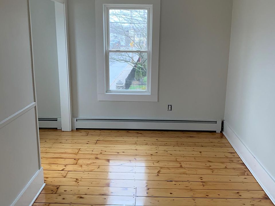 Upstairs bedroom w gleaming hardwoods