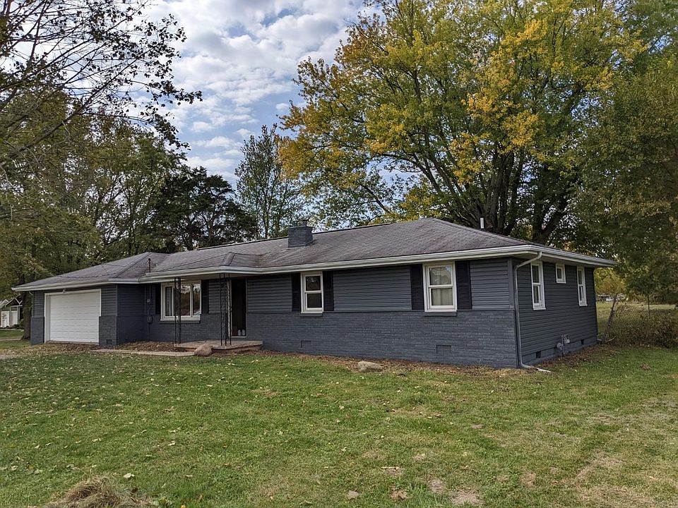 Front of newly painted 4 bedroom home with 2 baths