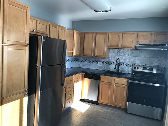 Updated kitchen with stainless steel appliances and granite countertops