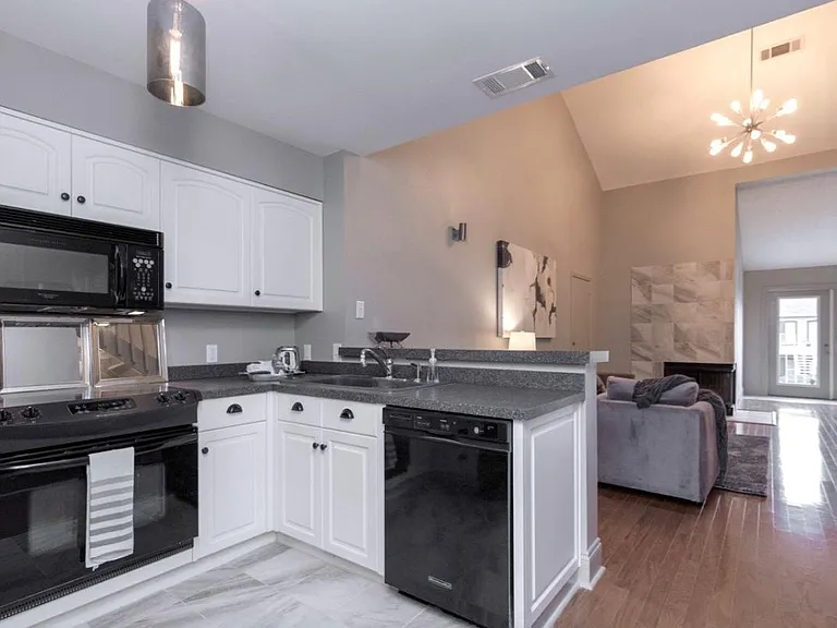 Kitchen looking towards vaulted livingroom