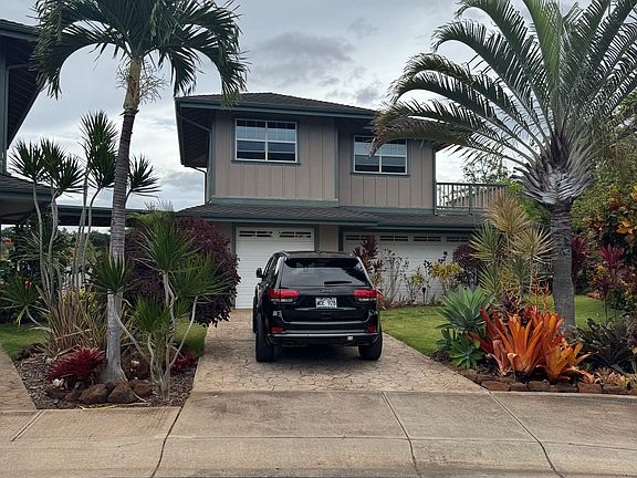 own driveway with 3-car garage