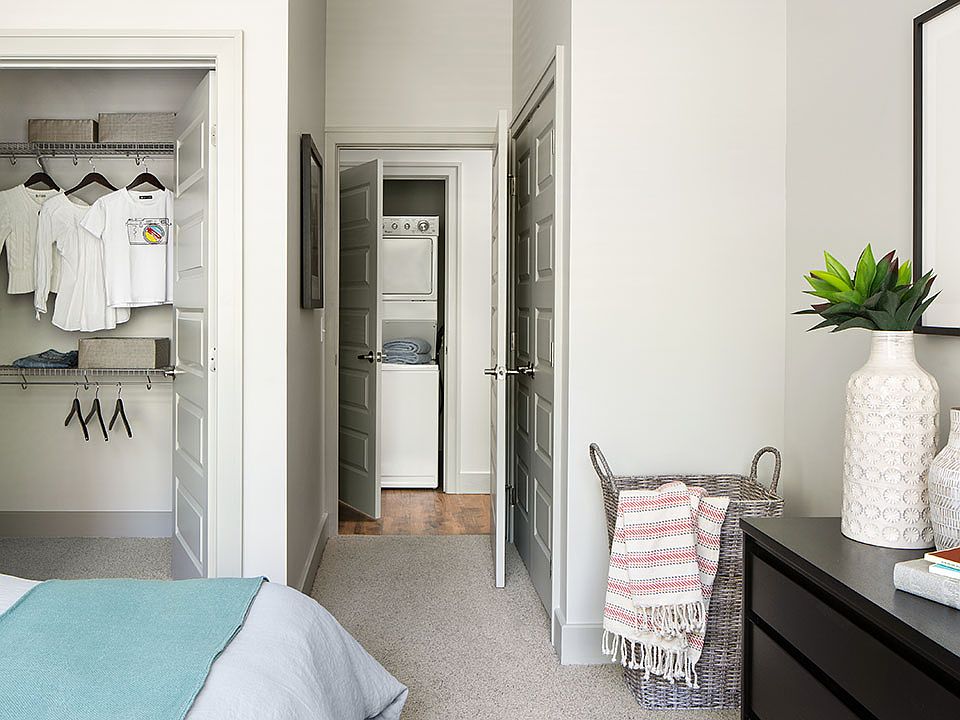 Spacious apartment Bedroom with Large Closet and Carpeted Floor.
