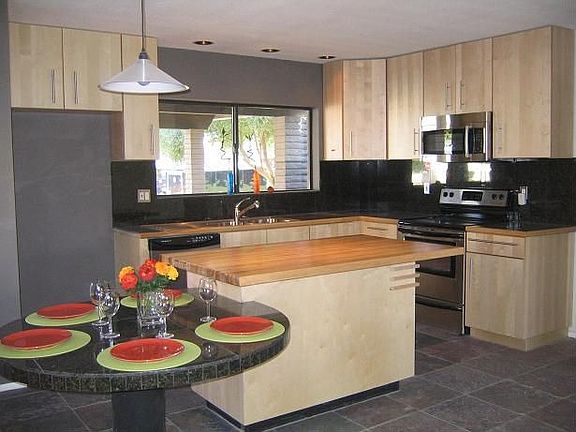 custom engaged table, granite, stainless.