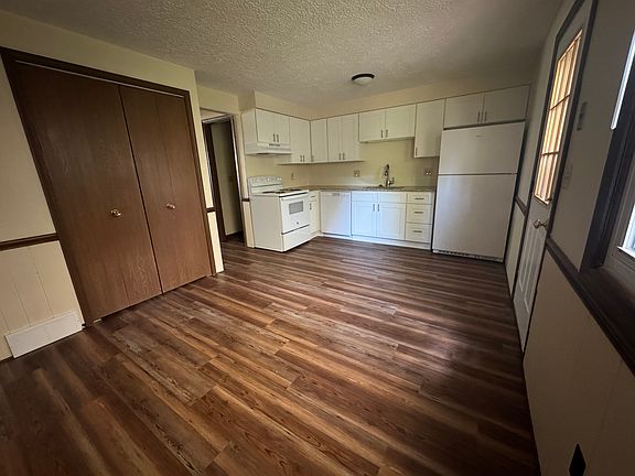 New kitchen - all new cabinets, new appliances (fridge, dishwasher and stove) and new sink and faucet, new granite countertops and new LVT floors