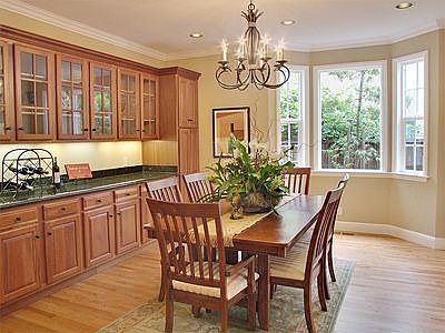 Elegant formal dining room with extensive built-in cherrywood cabinetry