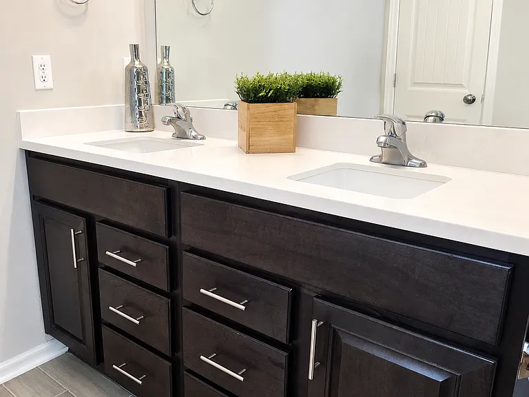 A spacious double vanity with plenty of storage to keep daily essentials organized.