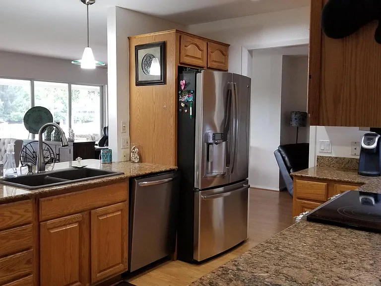 OLD photo! Recently remodeled. Fully updates Kitchen/Bath and furniture. Kitchen is now white shaker cabinets, white quartz countertop and with large island seating