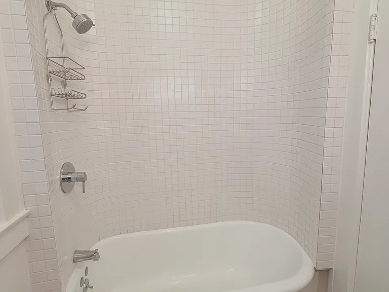 Tile enclosed Claw foot tub