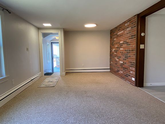 Main entry and open concept living/dining area.
