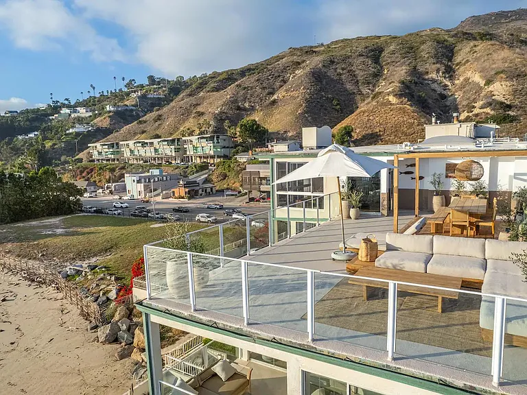Relax in style on the deck, featuring an oversized teak sofa and the soothing sounds of the Pacific.