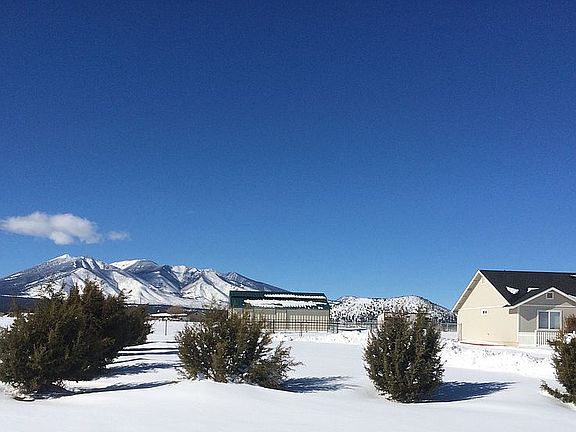 Winter view of barn and hous