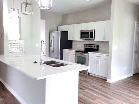 spacious kitchen with new cupboards and appliances