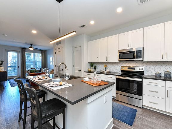 Our gourmet kitchens feature designer finishes and stainless steel appliances.