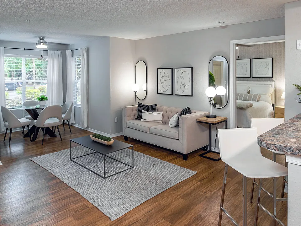 This thoughtfully designed living room flows effortlessly into the solarium, creating a light-filled space perfect for both entertaining and relaxing.