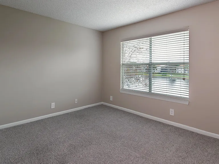 Immerse yourself in spacious bedrooms with large windows outfitted with adjustable blinds.