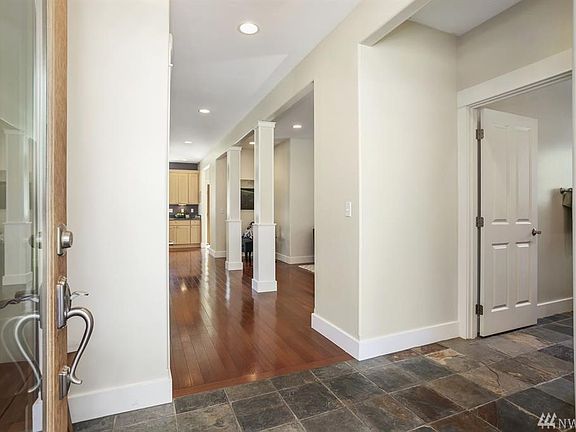 As you enter, the main level bedroom and bathroom are tucked off to the right. 