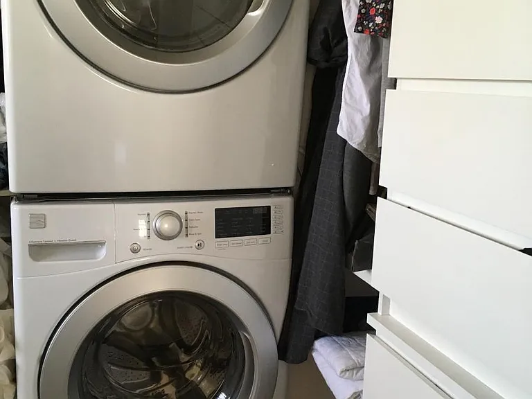 washer and dryer, built in drawers in primary bathroom